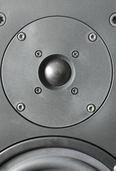 close up on the tweeter mouned in a hi-fi speaker cabinet
