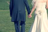 cross processed image of a wedding couple holding hands