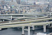 View of Osaka, Japan, showing the road network with elevated flyovers and bridges in the foreground