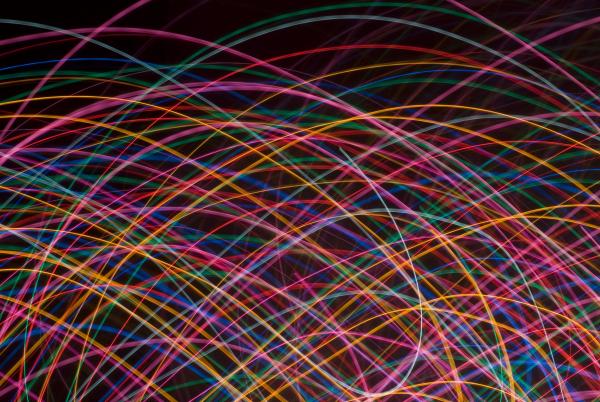 multicoloured crisscrossing curved lines of coloured light on a black background. I used this composition for my twitter background http:/twitter.com/Creativity103
