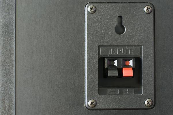 spring loaded audio connection terminals on the back of a hi-fi speaker cabinet