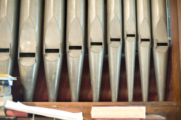 close up on the organ pipes of a small church organ