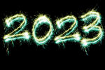 New Years 2023 digits drawn with bright sparkling lights isolated on black background